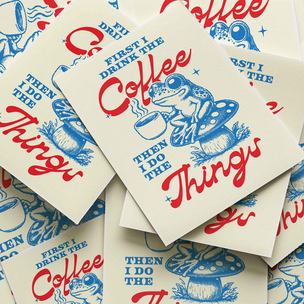 Vintage style coffee print with blue frog and mushroom art—'First I drink the coffee then I do the things' quote
