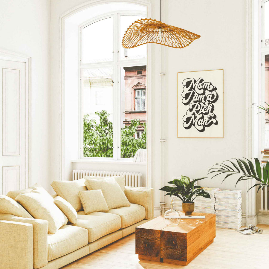 Framed 'Mom, I Am a Rich Man' wall art in chic neutral living room with natural light and modern decor.