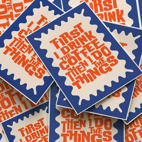 Bold graphic quote poster in orange and navy that says “First I drink the coffee then I do the things.” Modern coffee lover’s kitchen print.