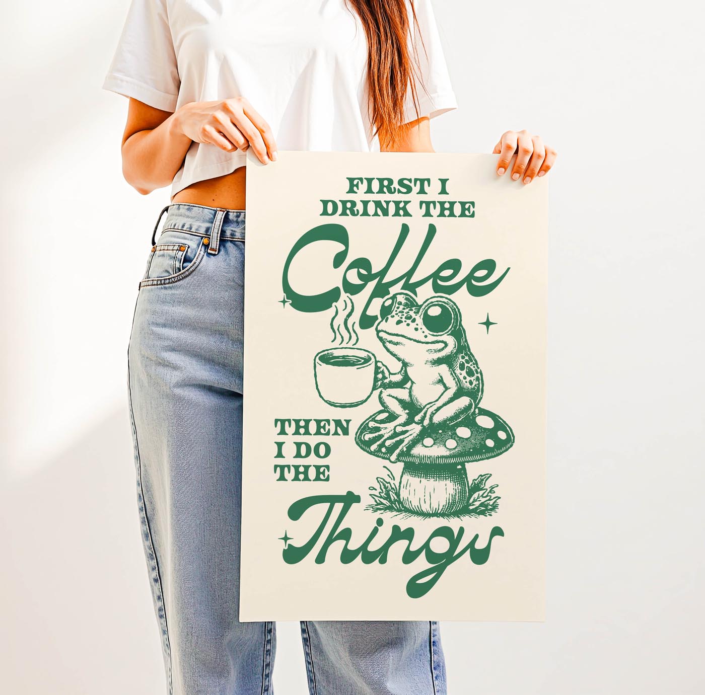 Whimsical “First I Drink the Coffee Then I Do the Things” print featuring a cute frog with a coffee cup sitting on a toadstool—perfect cozy cottagecore wall art for coffee lovers.