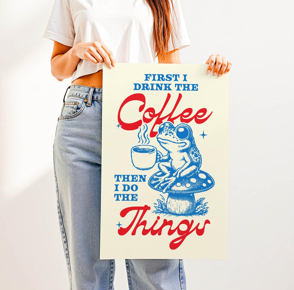 Whimsical “First I Drink the Coffee Then I Do the Things” print featuring a cute frog with a coffee cup sitting on a toadstool—perfect cozy cottagecore wall art for coffee lovers.
