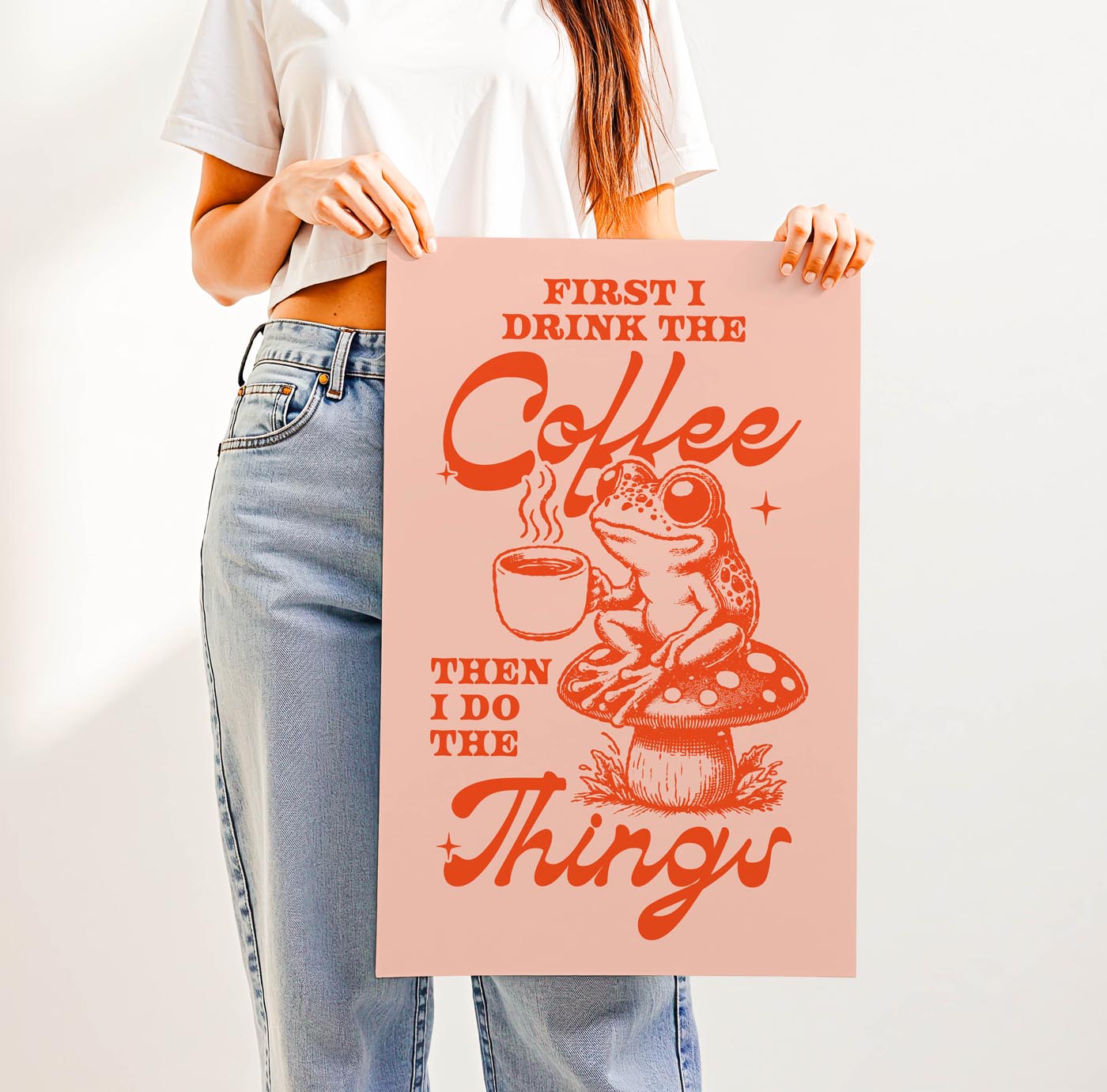 Whimsical “First I Drink the Coffee Then I Do the Things” print featuring a cute frog with a coffee cup sitting on a toadstool—perfect cozy cottagecore wall art for coffee lovers.