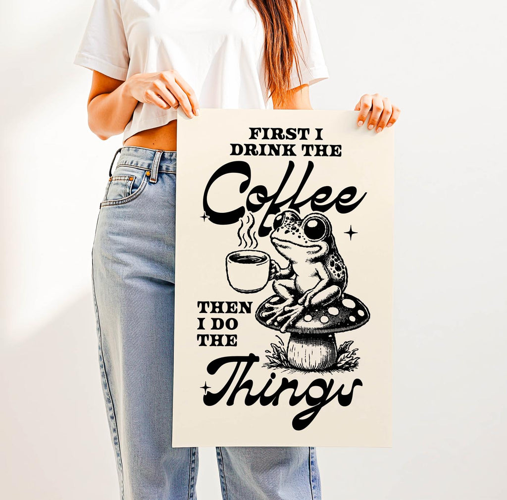 Whimsical “First I Drink the Coffee Then I Do the Things” print featuring a cute frog with a coffee cup sitting on a toadstool—perfect cozy cottagecore wall art for coffee lovers.