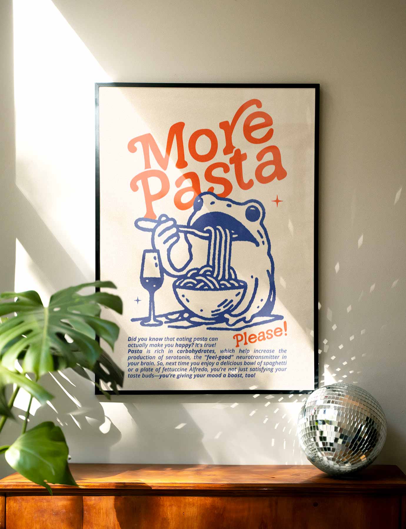 Whimsical frog art holding pasta with “More Pasta” quote—funny and cozy wall print perfect for kitchens, dorms, or pasta lovers with a sense of humor.
