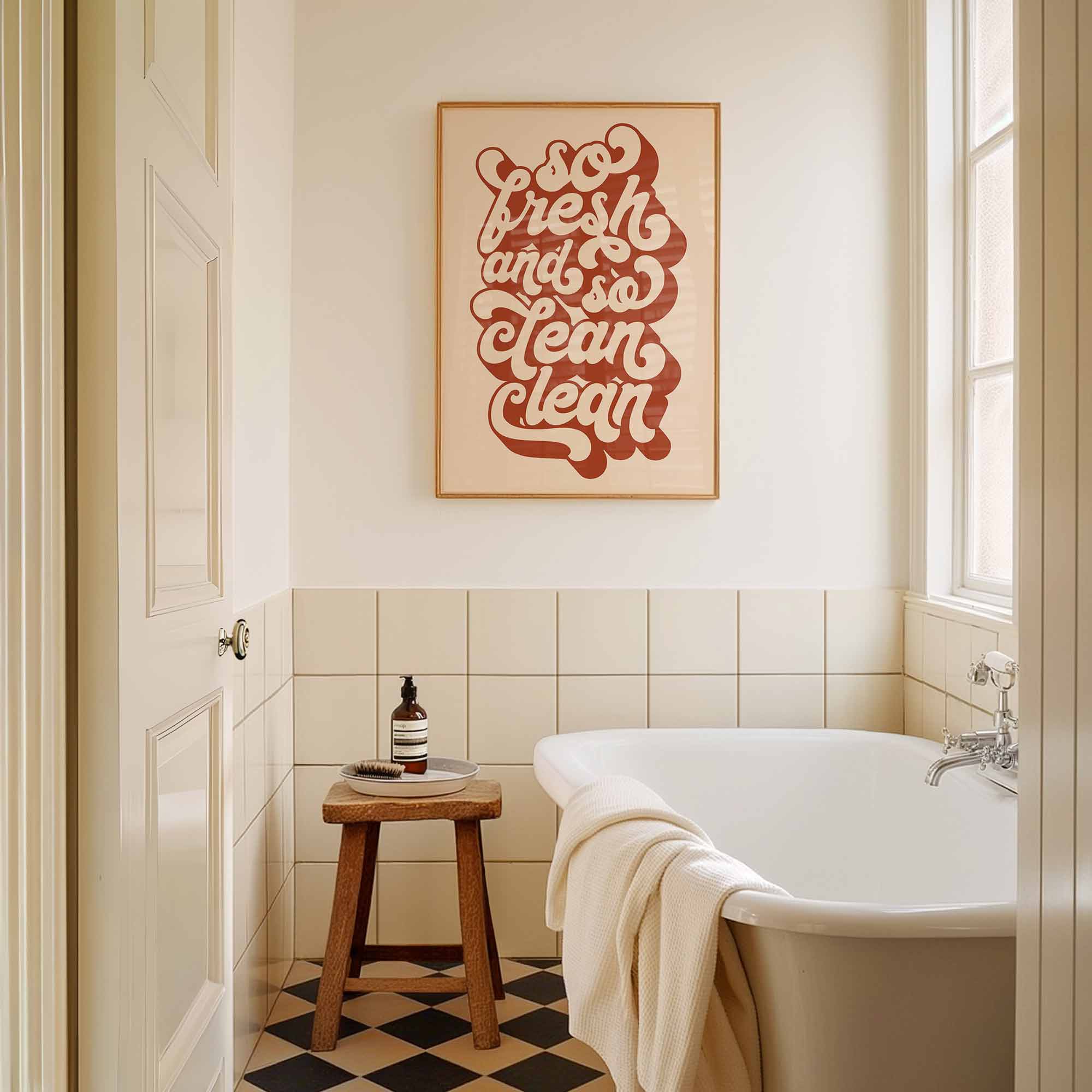 Bold typographic wall art in warm rust red that says “So Fresh and So Clean Clean” — perfect for modern bathrooms.