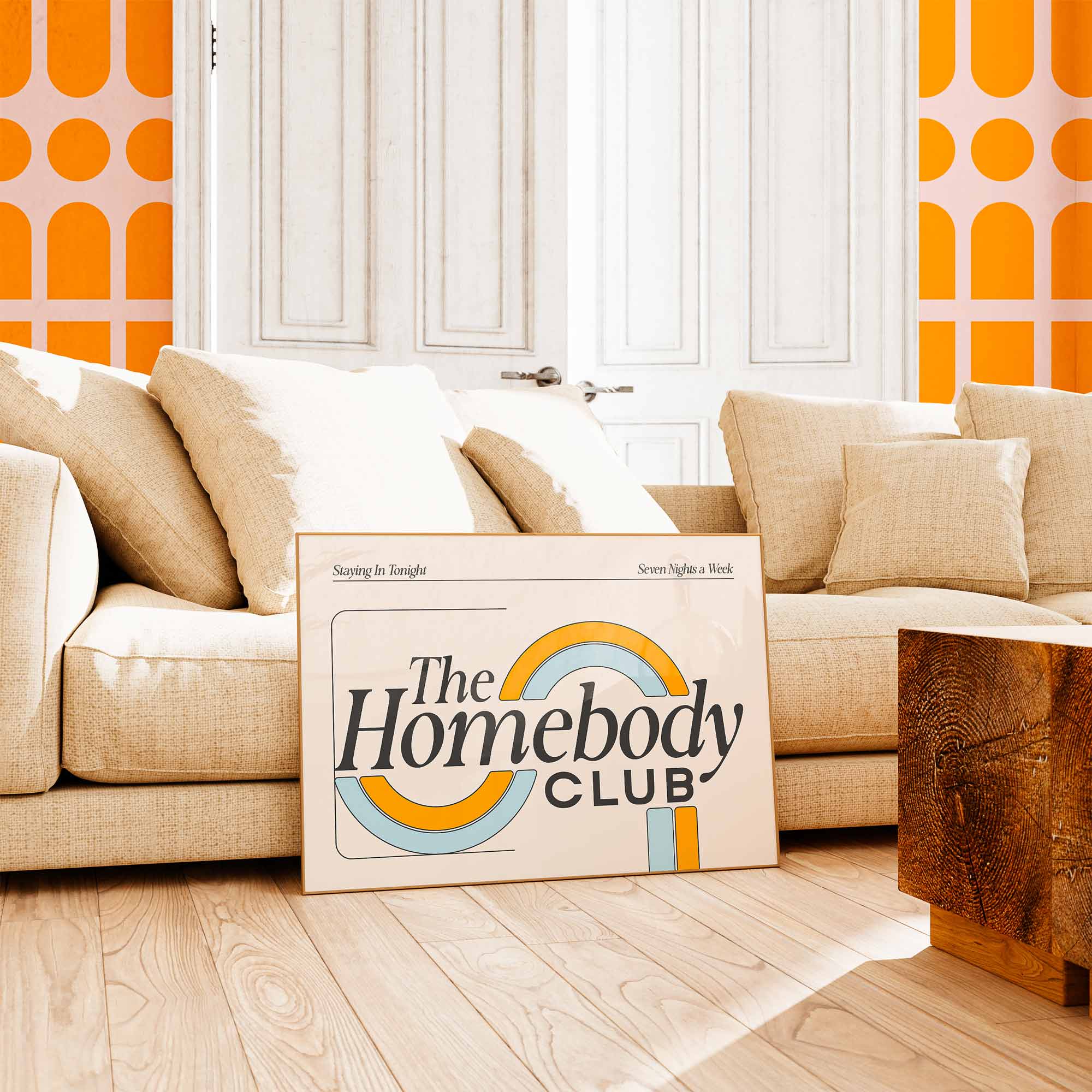 Mid-century inspired typography art reading “The Homebody Club” with soft retro curves and pastel orange and blue arches.